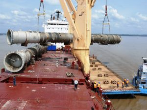 Deethanizer towers discharging onto a barge in the Amazon River